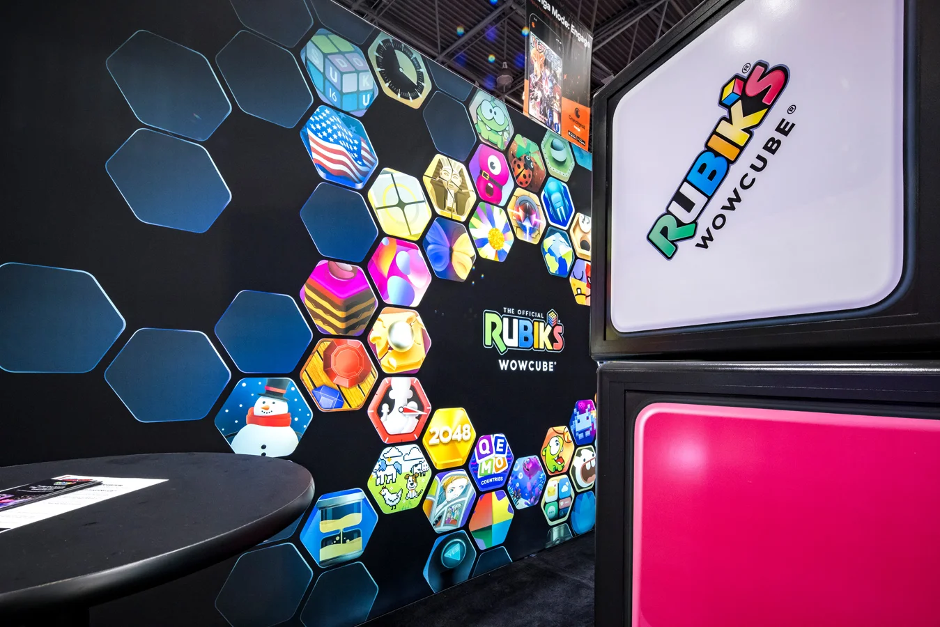 Rubik’s WowCube trade show booth featuring colorful hexagonal game icons and the Rubik’s WowCube logo