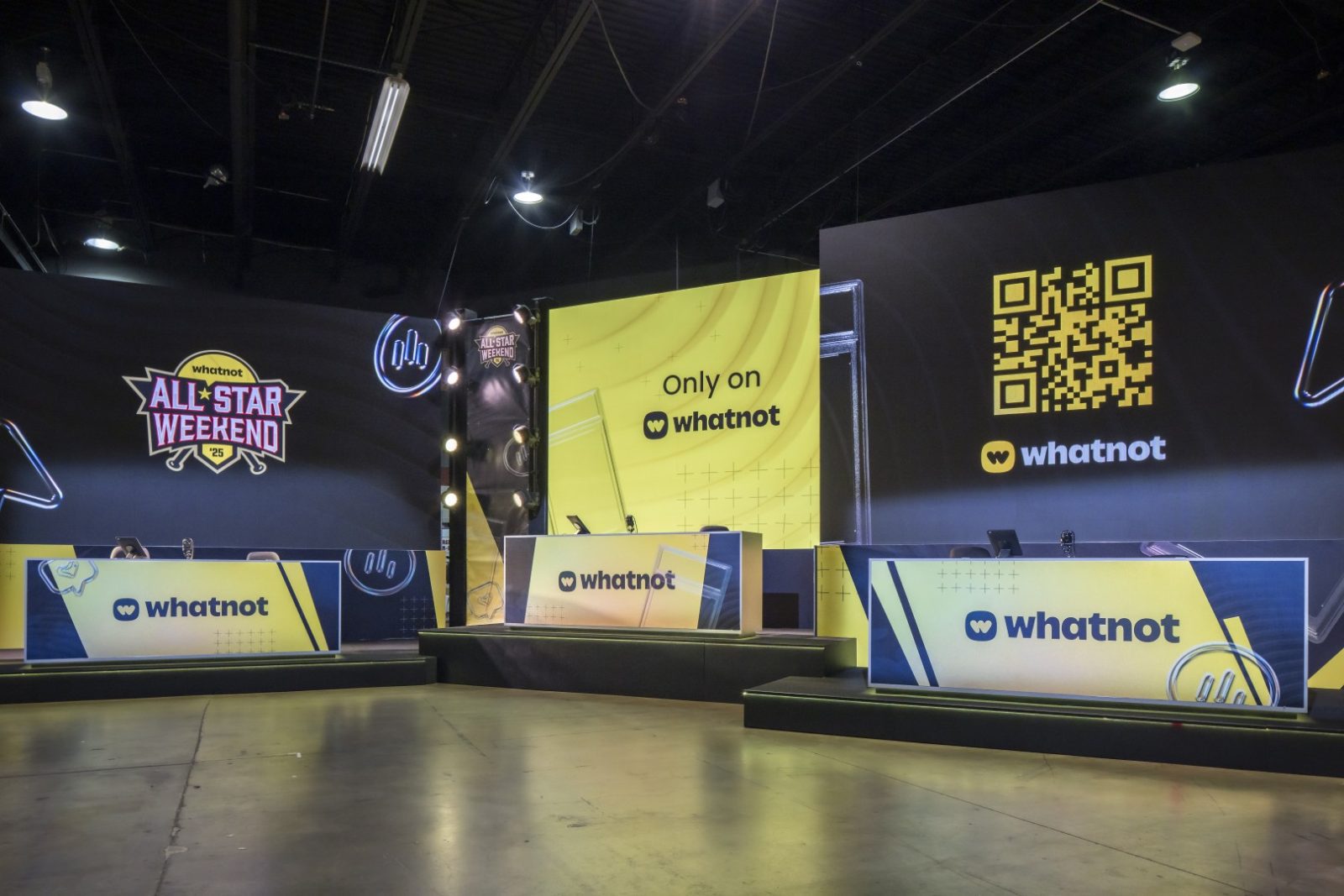 Whatnot All-Star Weekend ’25 stage with branded screens, a central desk, and a large QR code display.