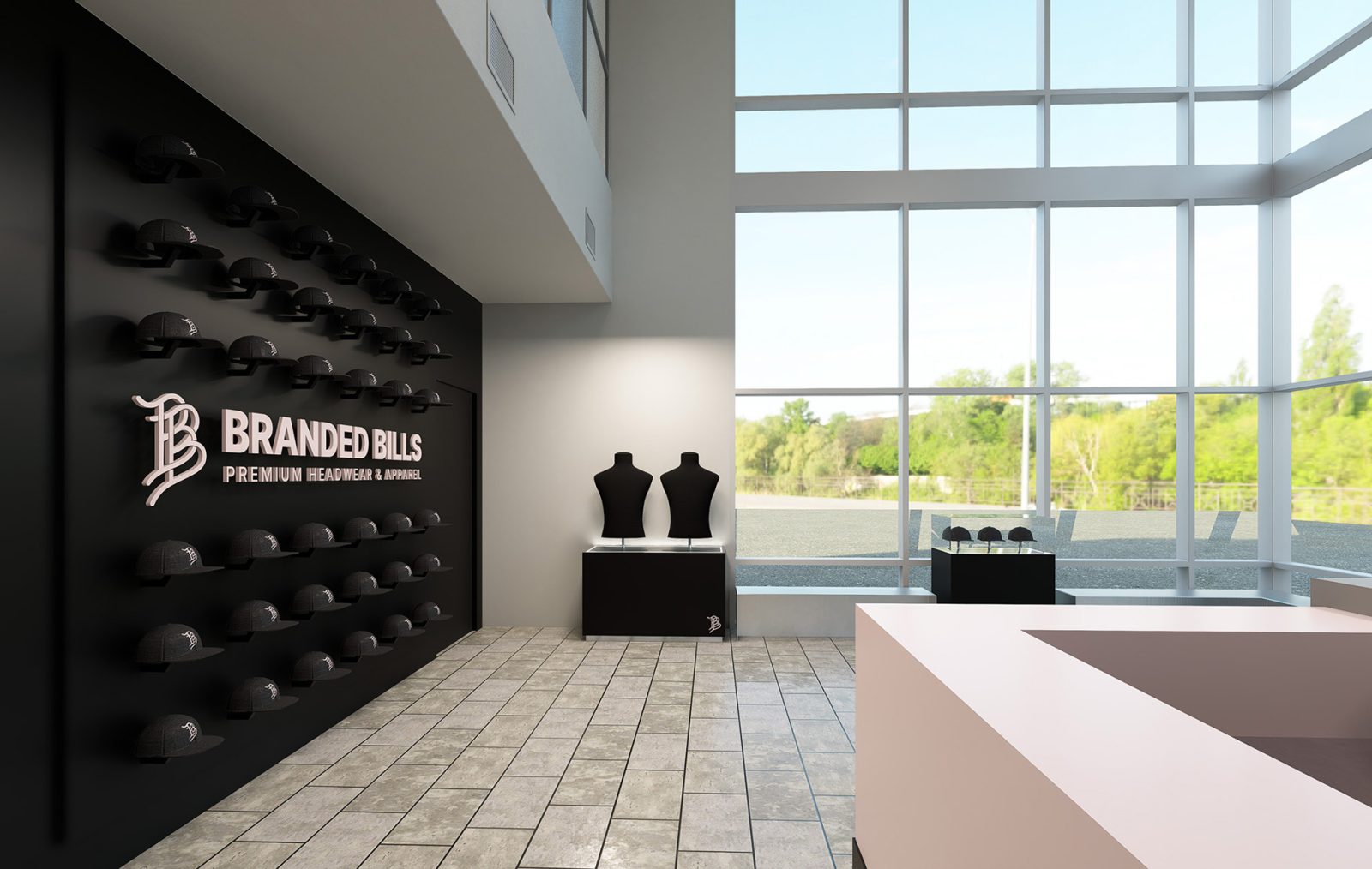 Branded Bills showroom with rows of caps, two mannequins, and a wall sign reading “BRANDED BILLS PREMIUM HEADWEAR & APPAREL.”