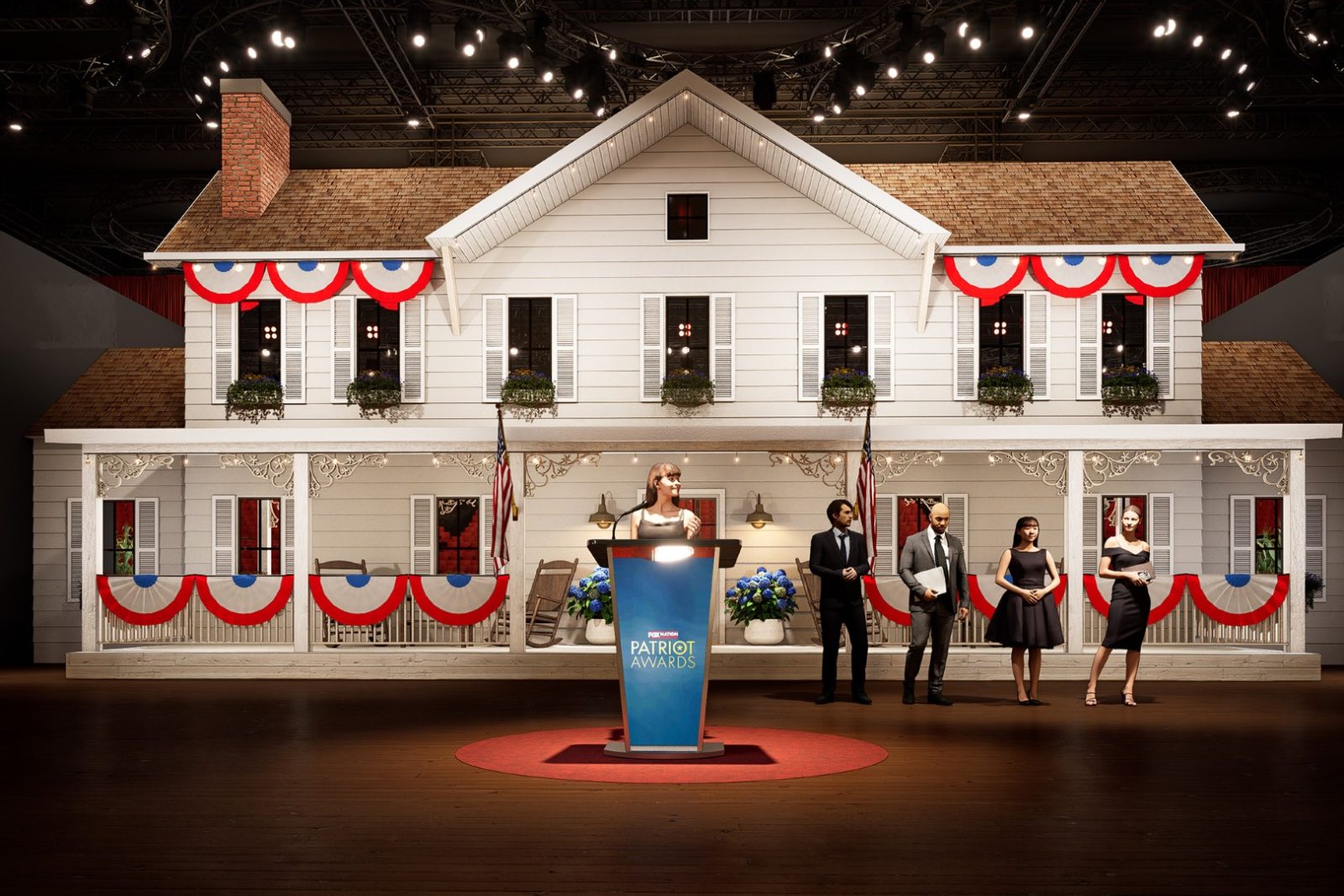 Patriot Awards podium on a stage designed as a white Southern-style house, with four people standing behind it.