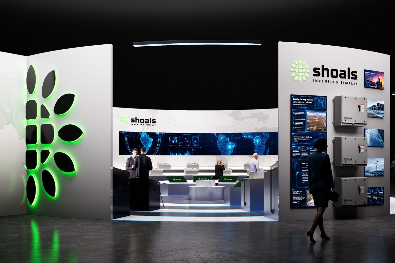 Shoals exhibition booth displaying branded electrical equipment, digital panels, and a glowing green logo while attendees walk through