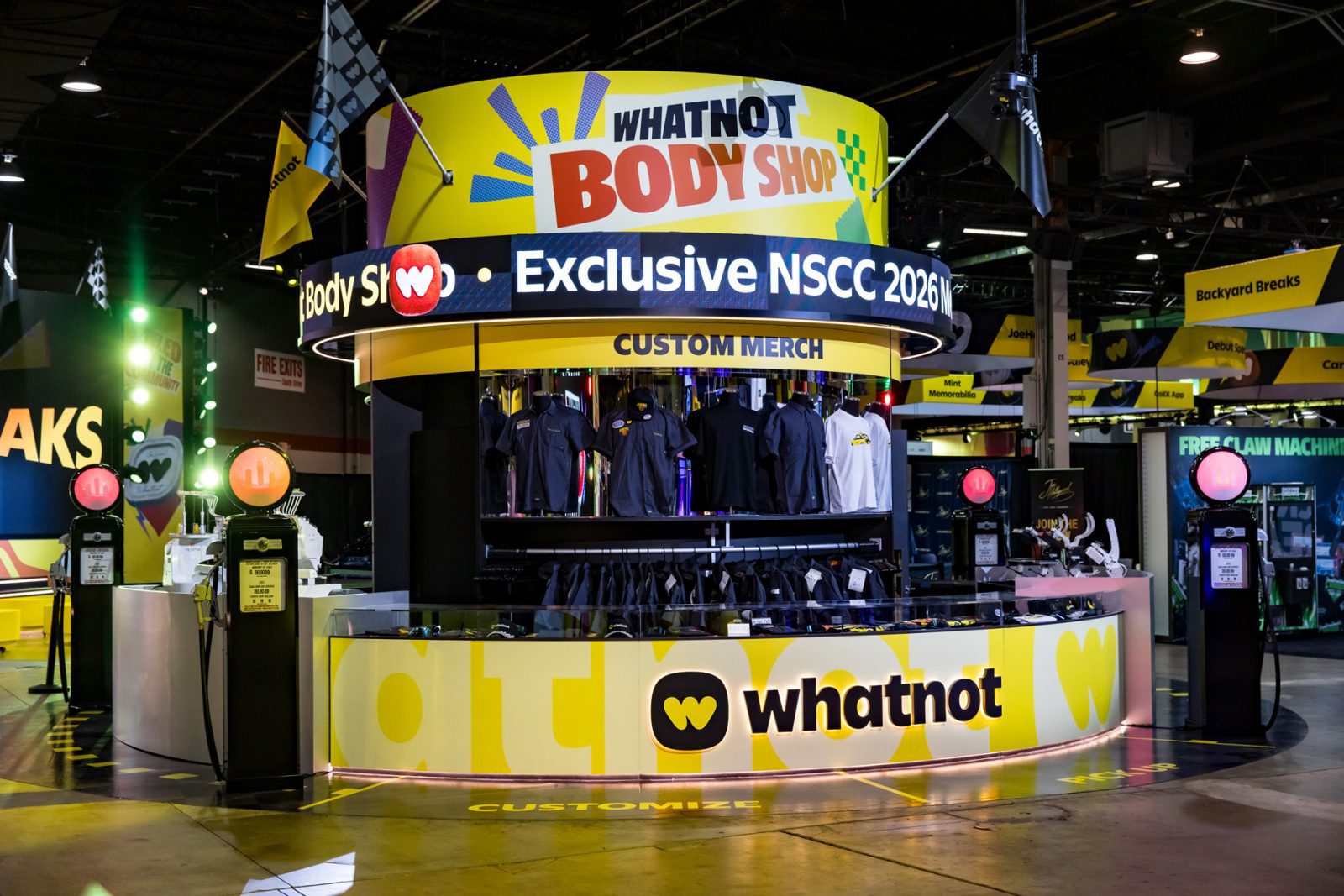 Whatnot Body Shop custom merch booth displaying clothing and signs for Exclusive NSCC 2026