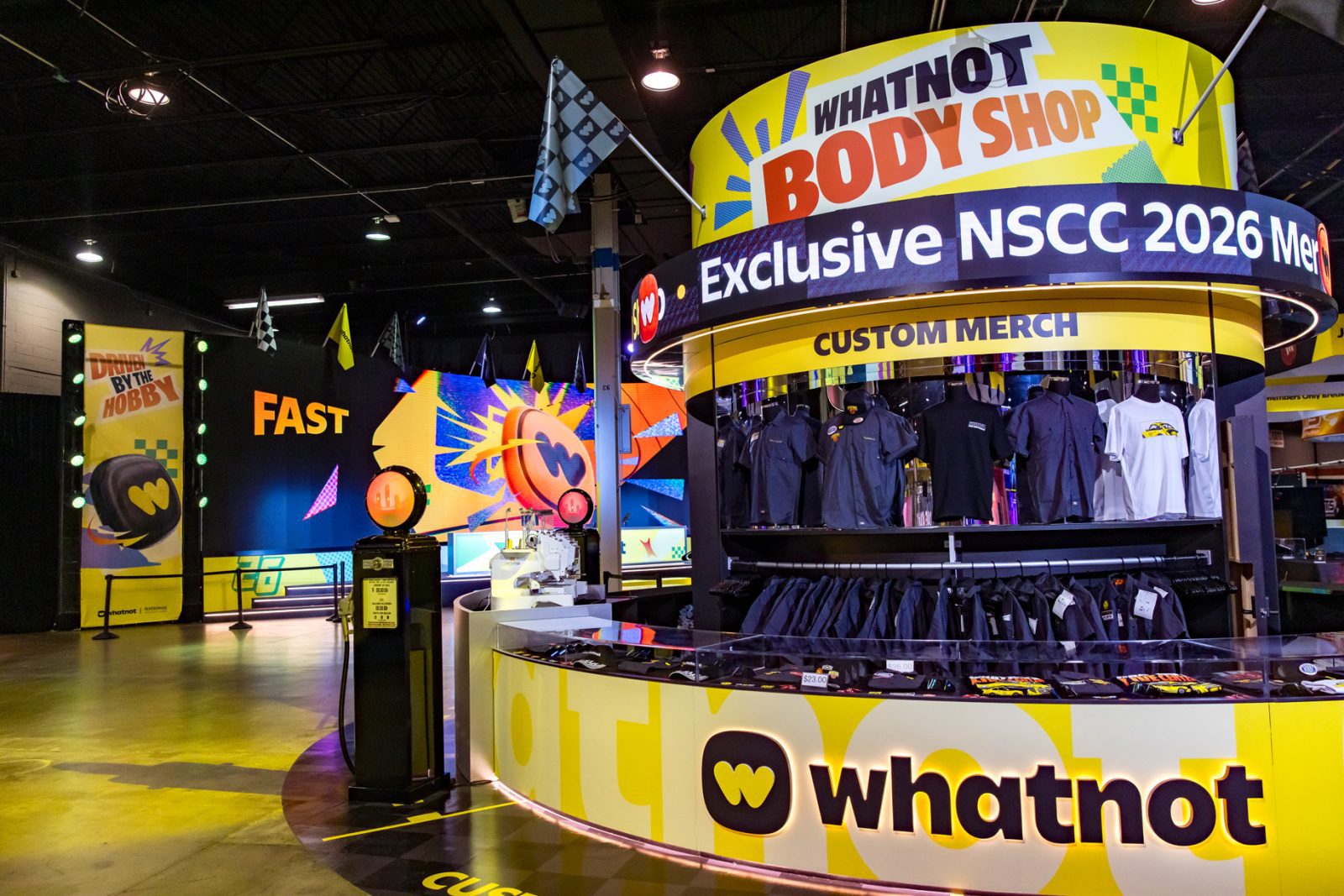 Whatnot Body Shop custom merch booth with clothing displays and signage for NSCC 2026