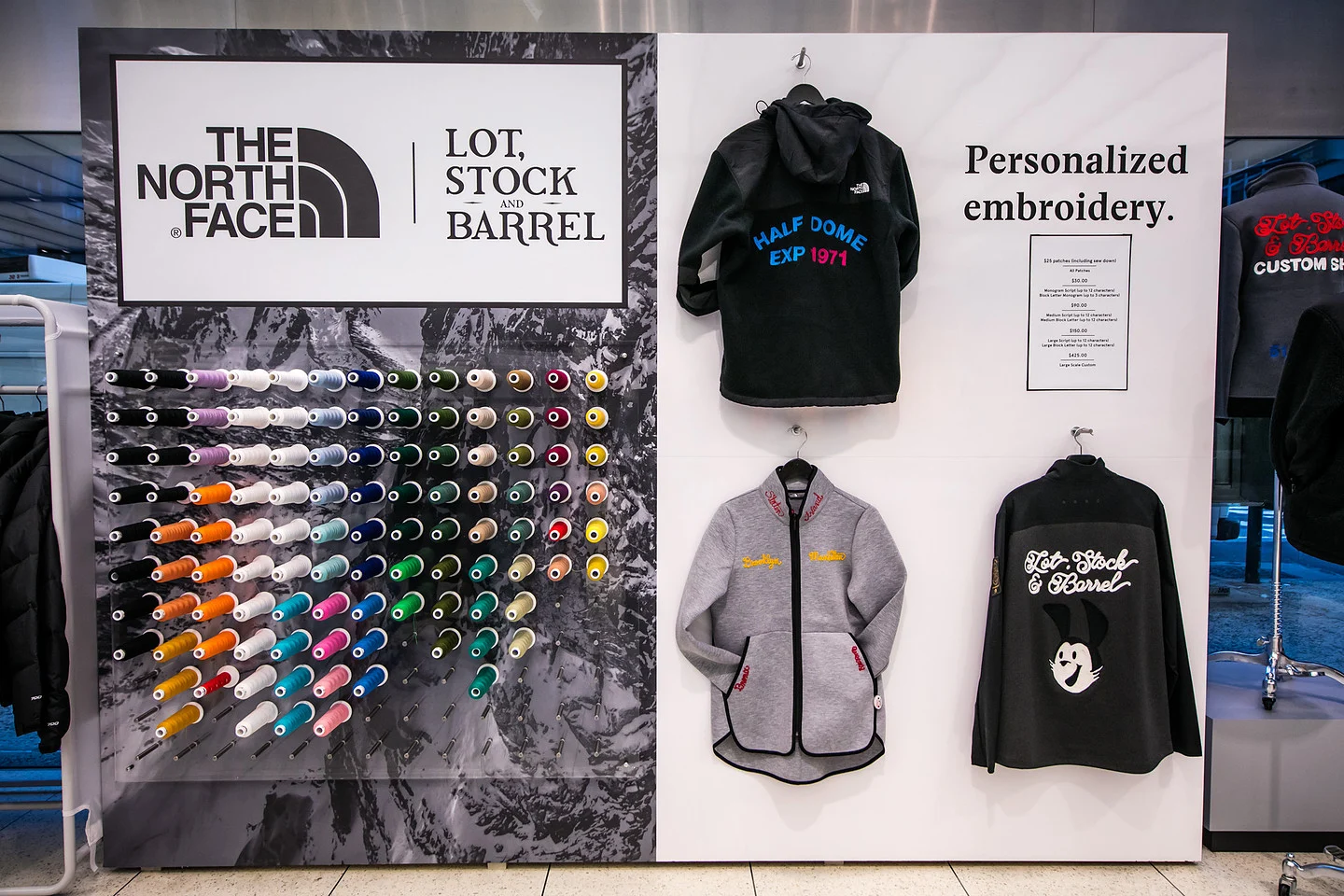 The North Face and Lot, Stock and Barrel display featuring colorful embroidery thread spools and custom embroidered jackets.