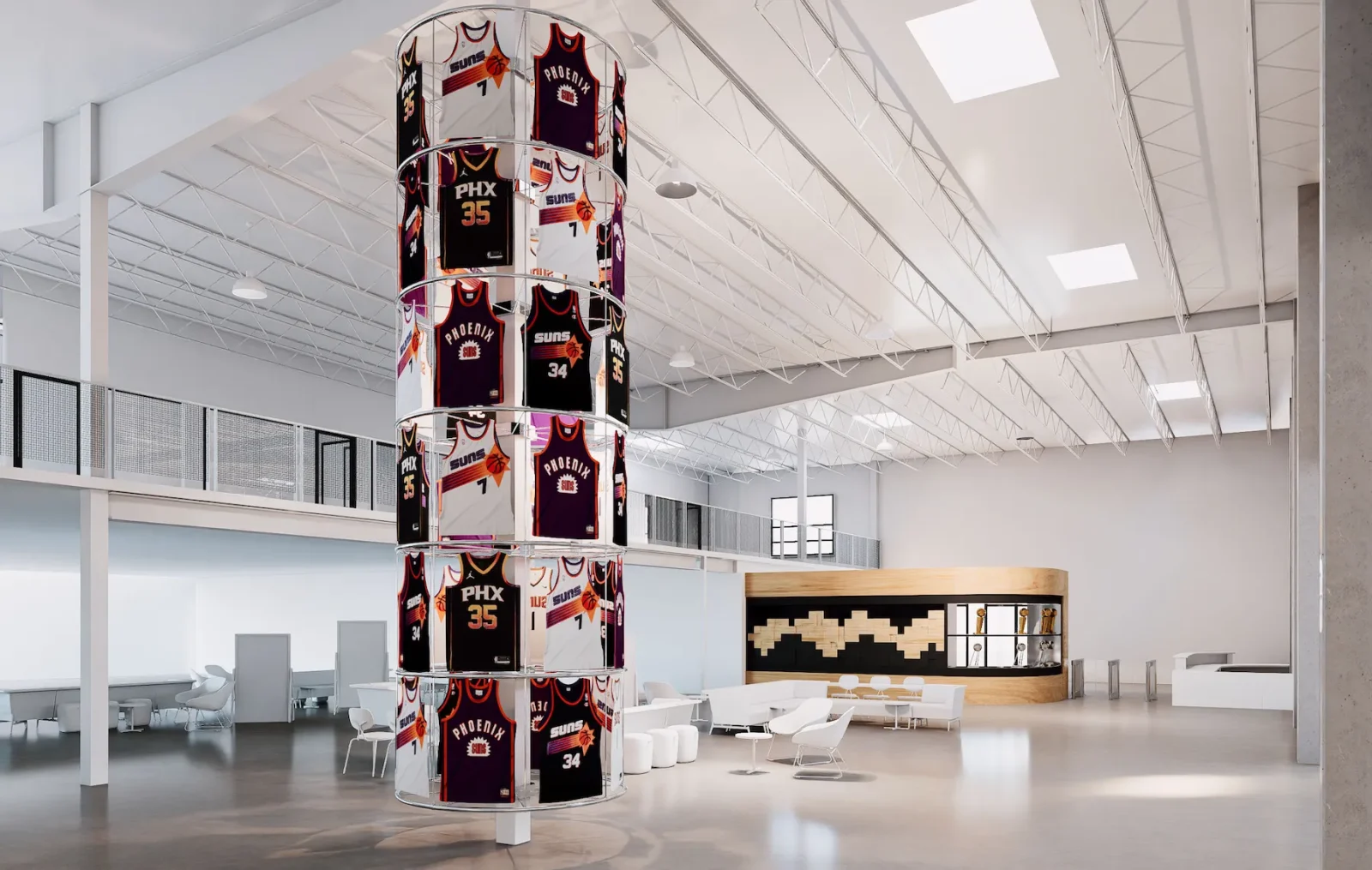 Circular tower displaying Phoenix Suns basketball jerseys in a bright modern lobby