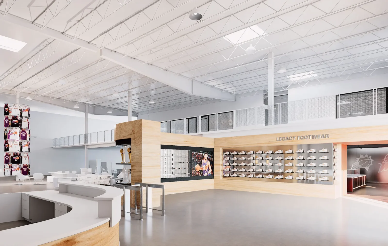 Phoenix Suns-themed retail space with a Legacy Footwear shoe display, basketball jerseys, merchandise, and Suns logo