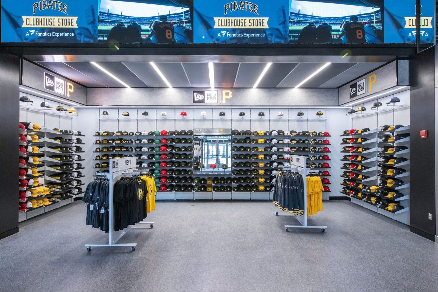Interior of a Pittsburgh Pirates Clubhouse Store displaying team caps, clothing, and New Era merchandise.