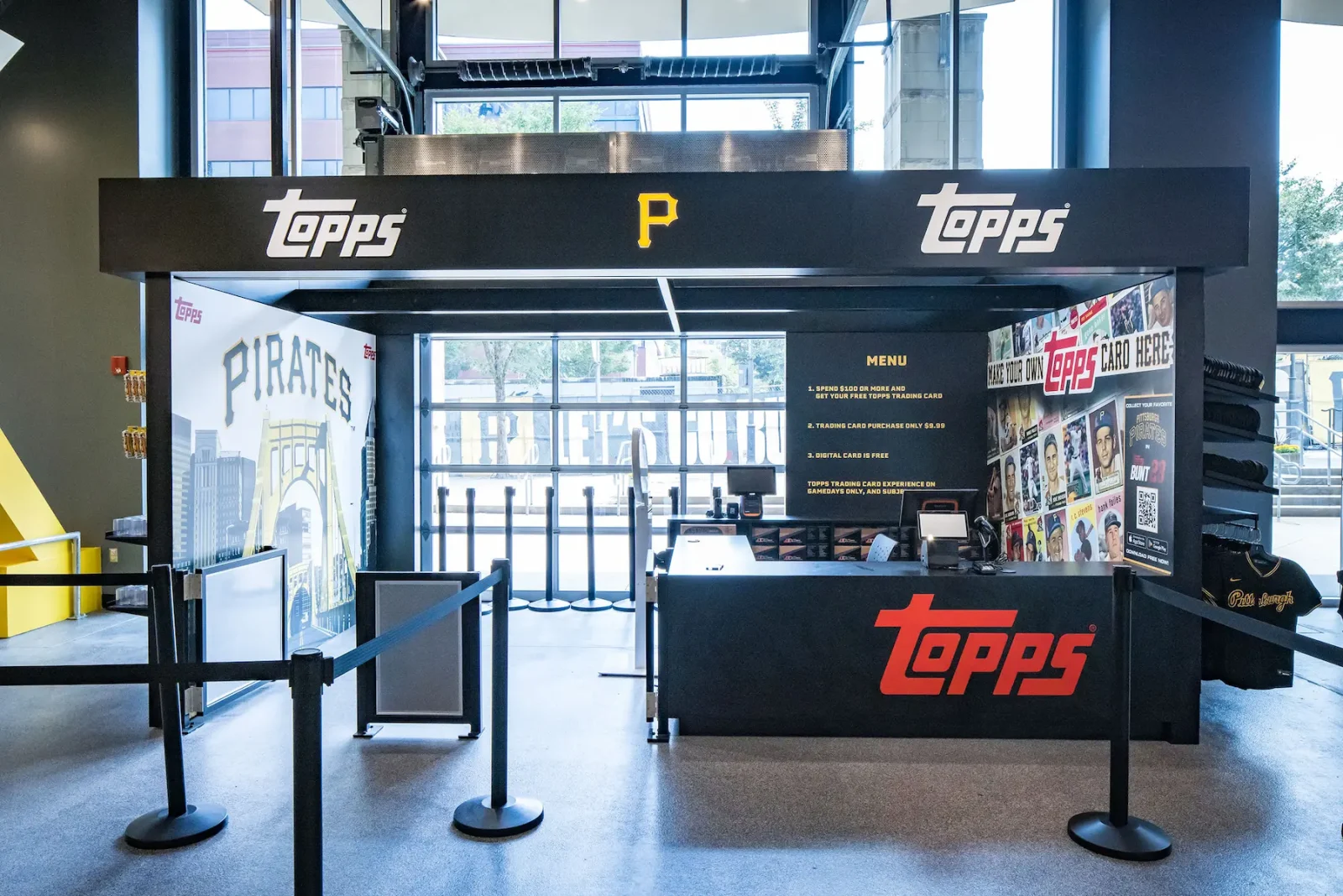 Pittsburgh Pirates Topps trading card store kiosk with branded counter, card displays, and promotional signs
