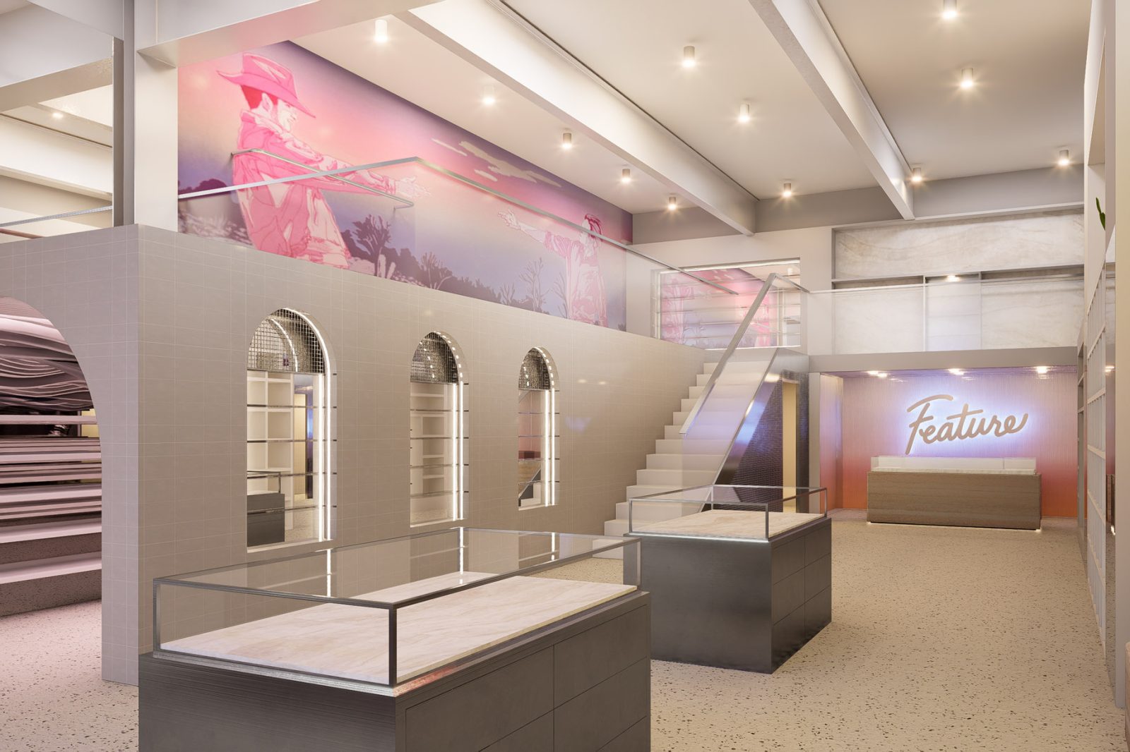Interior of a modern retail store with display cases, arched shelving, a staircase, and a pink mural; wall sign reads “Feature.”