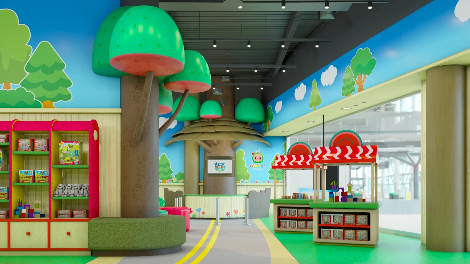 Colorful Cocomelon-themed children's play area with oversized trees, toy displays, and a small red-and-white market stall.